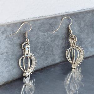 32 aretes jaula de diamantes negro