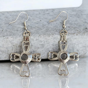 31 aretes cruz corazón