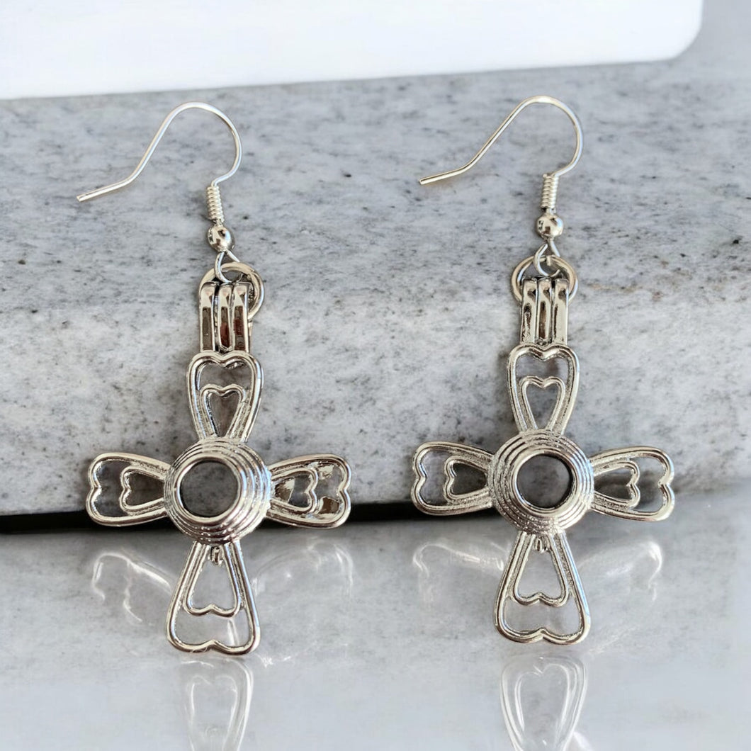 31 aretes cruz corazón